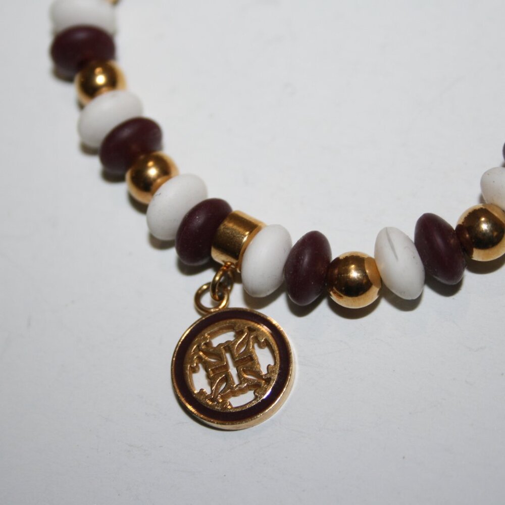 Beautiful gold, deep red and white charm bracelet 7"